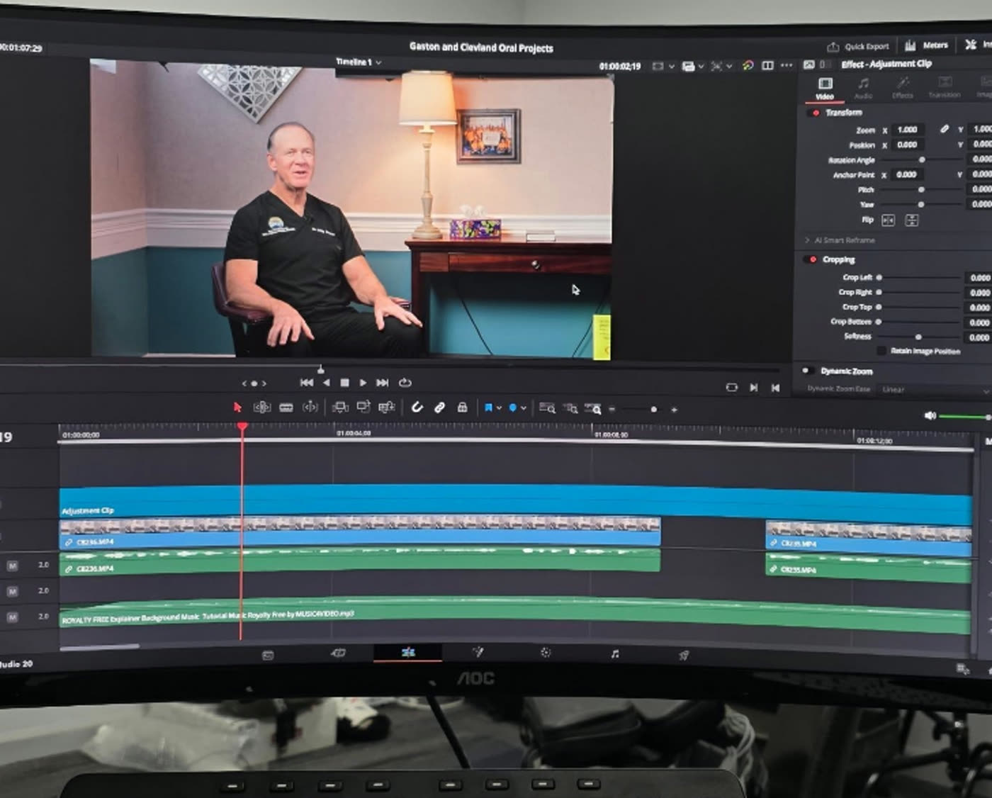 Video editing timeline on a monitor showing an interview cut